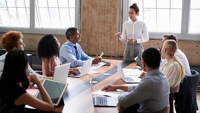 Woman leading business meeting