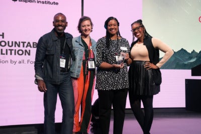 A photo of four members of the Deloitte team.