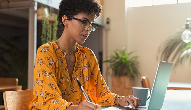 Latina worker on laptop