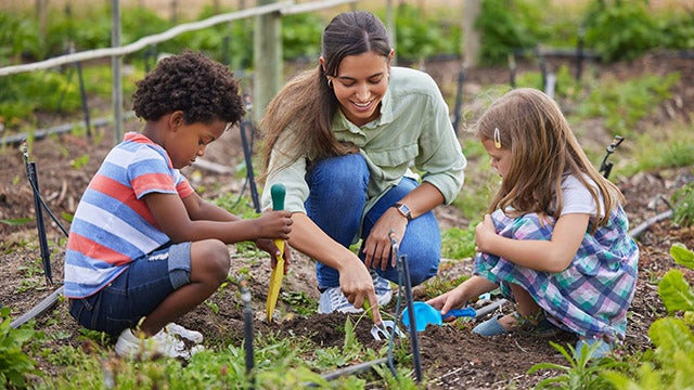 Students and teacher in school garden