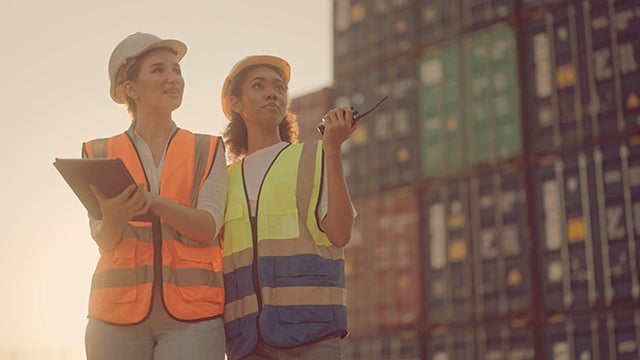 Two female shipping workers